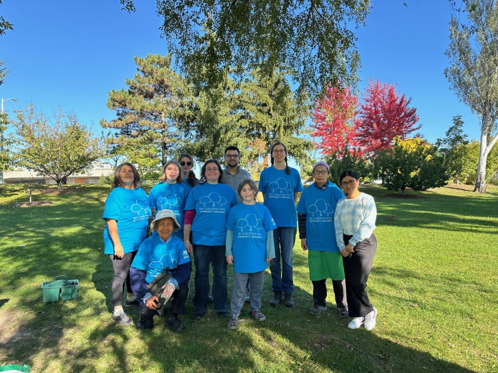 Volunteers in the park showing off their new volunteer T shirts.